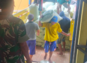 Babinsa Koramil Arjasa Kawal Distribusi Beras ke Gudang Bulog